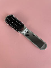 Mini cepillo para el pelo